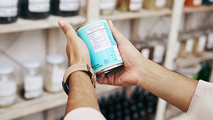 person checking ingredients information on product