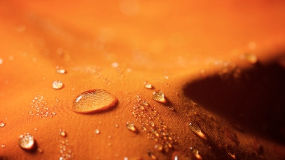 Close-up of the fabric of a waterproof mountain jacket.