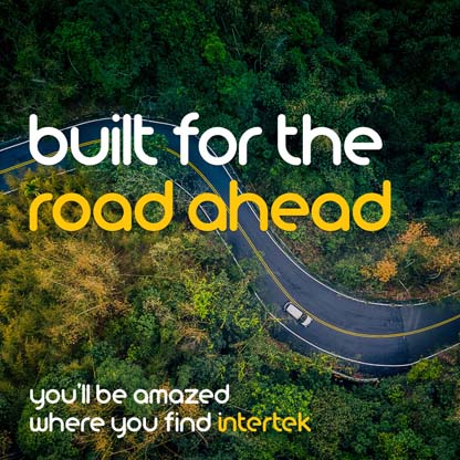 An aerial view of a curvy road with a car